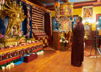 In the heart of Kalapa Temple, Khentrul Rinpoche prays before the 24-armed image of Kalachakra